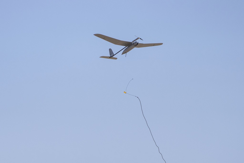 An Israeli drone is in the air after been launched by Israeli soldiers near the Israeli-Gaza border, southern Israel, Monday, April 15, 2024. (AP Photo/Ohad Zwigenberg