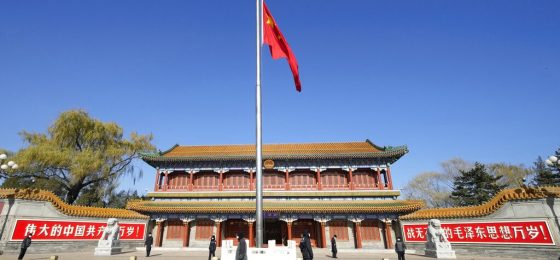 The Chinese national flag is flown at half-staff to mourn the death of former Chinese President Jiang Zemin outside the Xinhumen entrance to the Zhongnanhai leadership compound in Beijing, Thursday, Dec. 1, 2022. Jiang, who led China out of isolation after the army crushed the Tiananmen Square pro-democracy protests in 1989 and supported economic reforms that led to a decade of explosive growth, died Wednesday. He was 96. (AP Photo/Ng Han Guan)